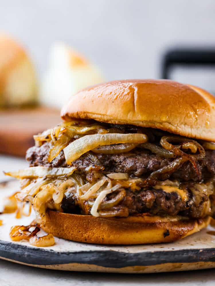 Oklahoma fried onion burgers are packed with so much flavor, thanks to each patty being stamped with heaps of sweet and savory caramelized onions! With how easy to make and delicious they are, you wonโt want burgers any other way. Hero image of an Oklahoma fried onion burger.
