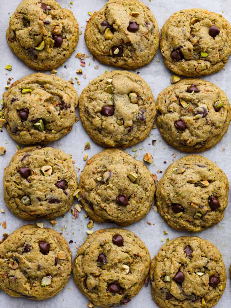 Nutty, sweet, and soft, these chocolate chip pistachio cookies are a must-try dessert! They're super easy to whip up and absolutely irresistible. Top-down view of 12 cookies.
