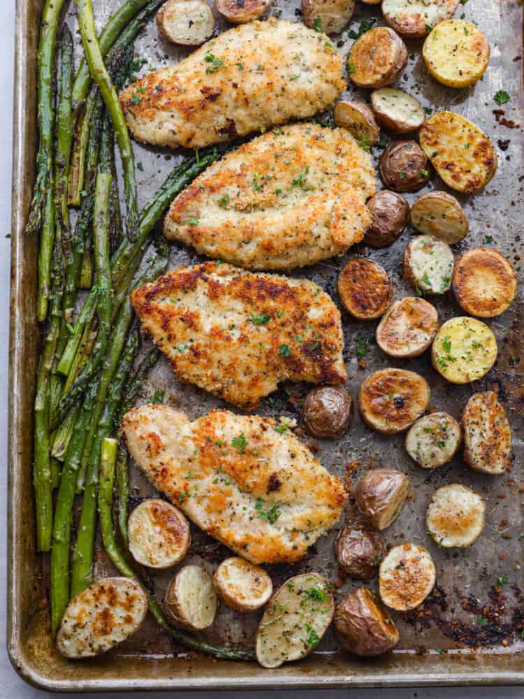 Sheet Pan Crispy Parmesan Garlic Chicken is such an easy meal with crispy breaded chicken with potatoes and asparagus. It's easy to make, easy to clean up, and is the perfect meal for any occasion!