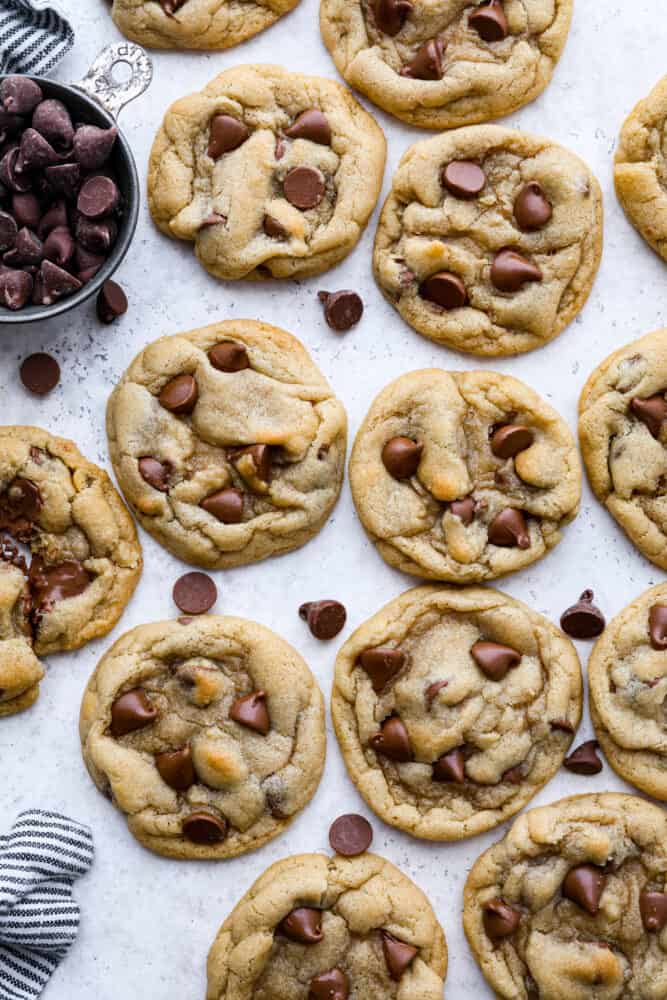 These are the Best Chocolate Chip Cookies that turn out perfectly every single time and don't require any chilling. This is a classic tried and true chocolate chip cookie recipe that you will make again and again! Baked chocolate chip cookies on a counter.