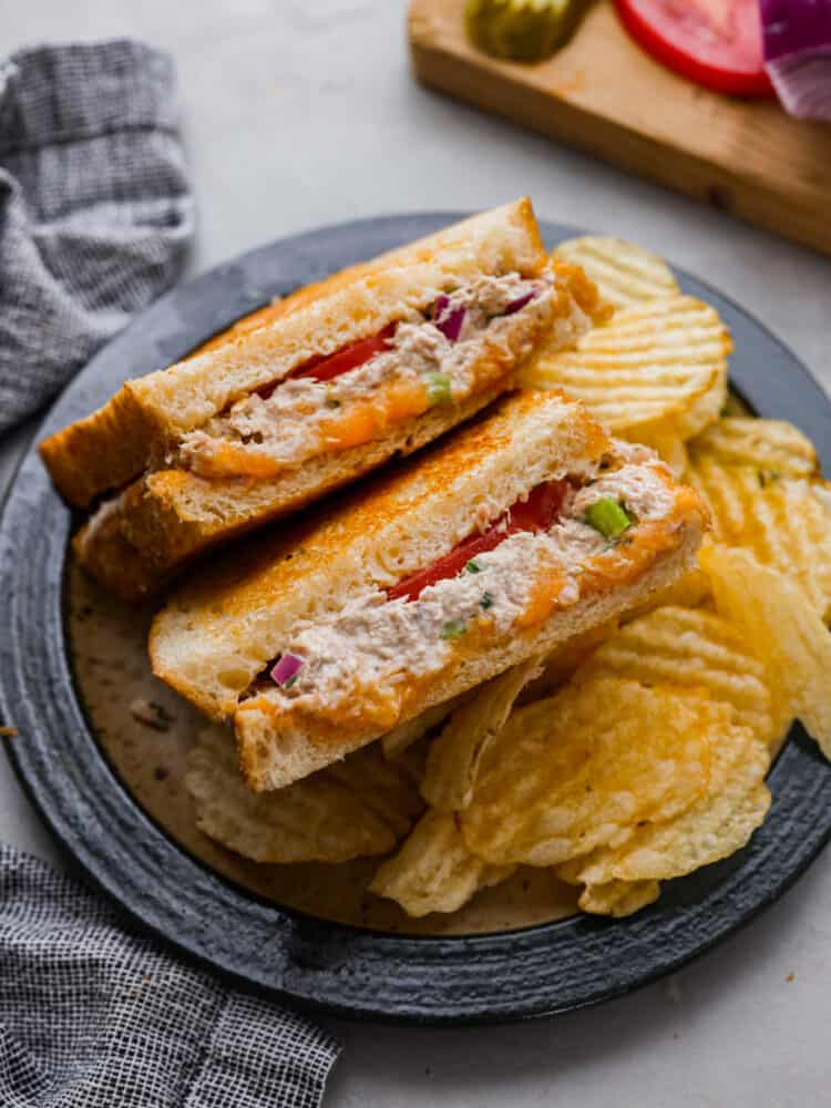 Tuna melts are the ultimate sandwich with a flavorful fish mixture, melty cheddar cheese, and freshly sliced tomatoes all melted together in a skillet on crispy, golden bread. So easy to make and delicious, this sandwich will literally melt in your mouth!