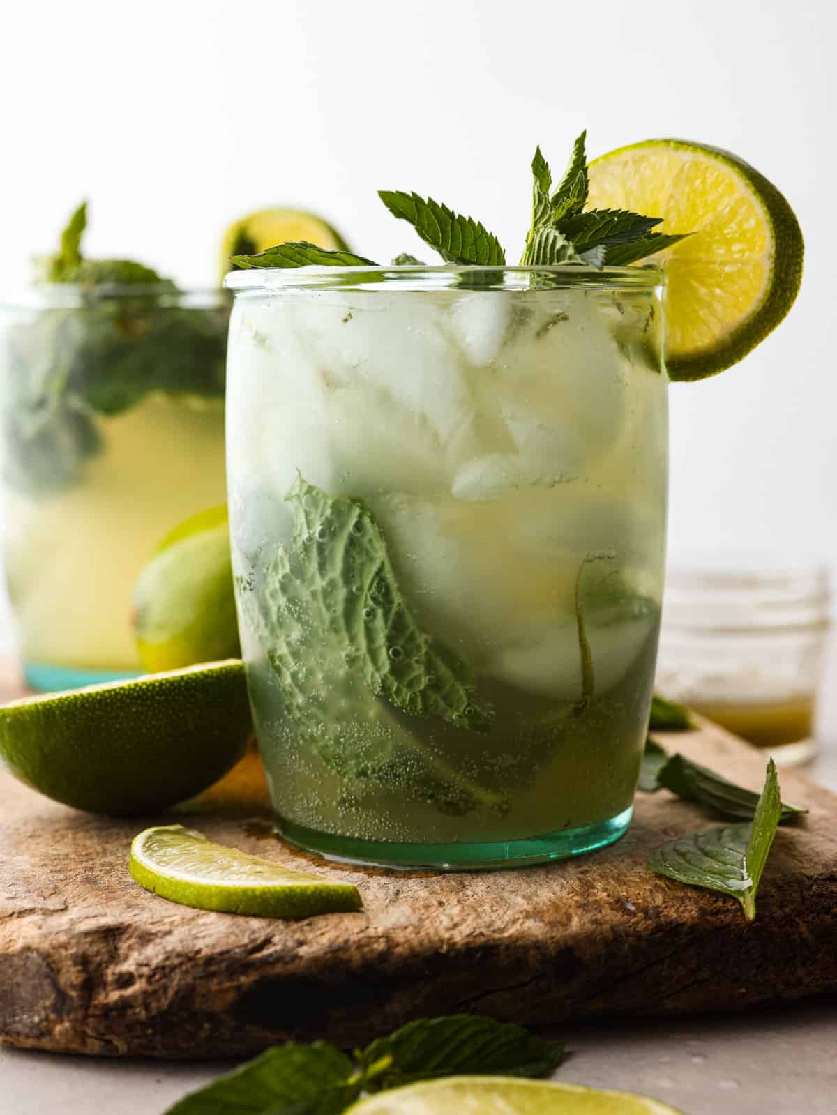 My Virgin Mojito is like a vacation in a glass. Crisp, minty, and packed with fresh lime flavor. This non-alcoholic drink is something my whole family loves! Glass of completed and garnished virgin mojito.
