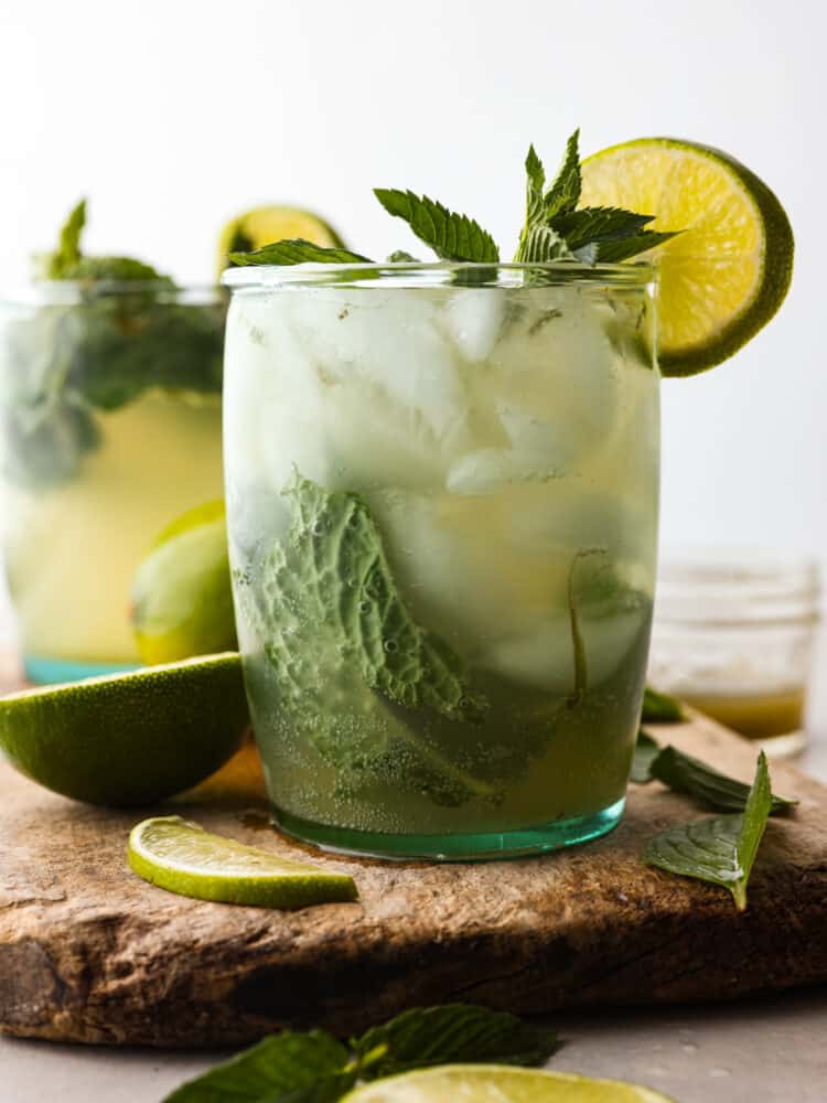 My Virgin Mojito is like a vacation in a glass. Crisp, minty, and packed with fresh lime flavor. This non-alcoholic drink is something my whole family loves! Hero image of a virgin mojito garnished with mint and lime slices.