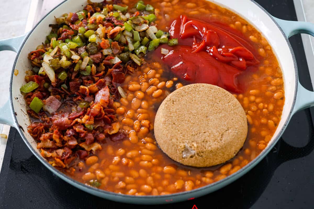 These World's Best Baked Beans will be the last recipe you will ever make! This easy recipe is the perfect side to a potluck and a tried and true family recipe that your family will go crazy over! Third photo of the ingredients combined in a pan.