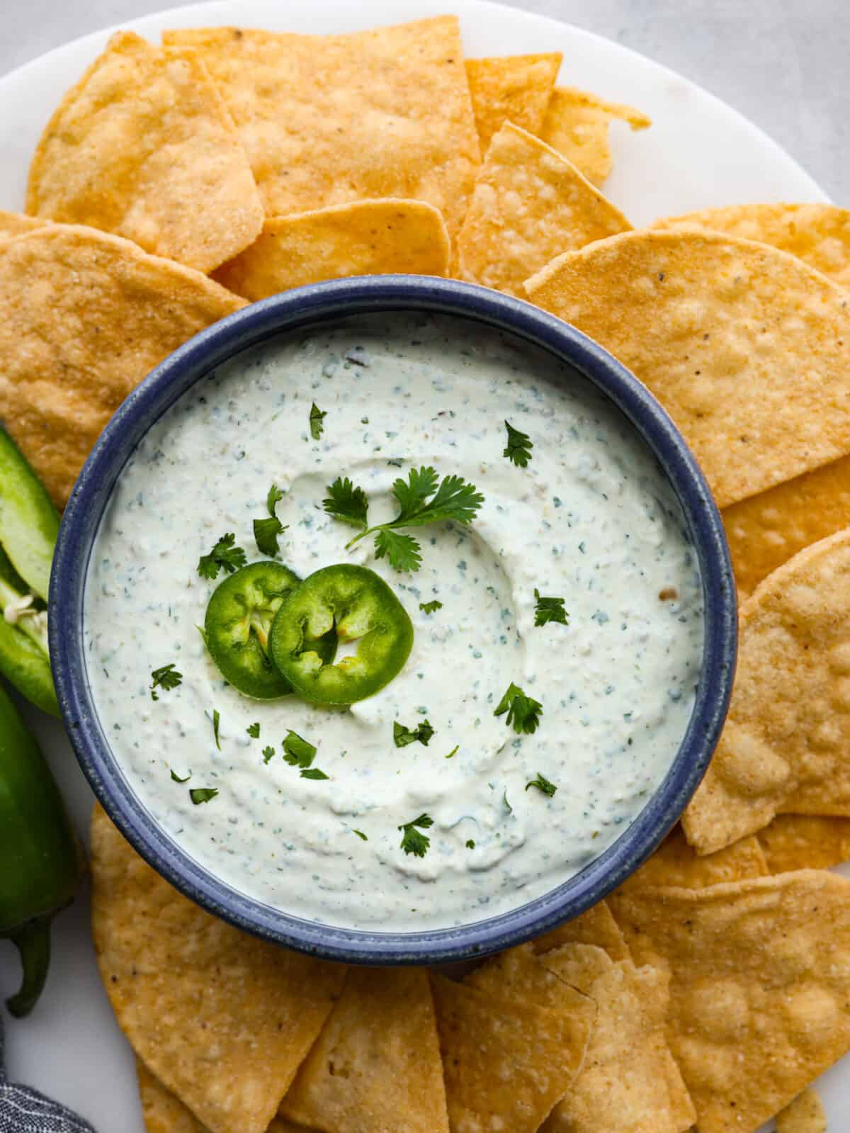 This zesty Jalapeño Dip is the ultimate crowd-pleaser! Blending cream cheese, sour cream, and canned pickled jalapenos with seasoning, it delivers a delightful mix of creaminess and heat. A close up top view of jalapeño dip.