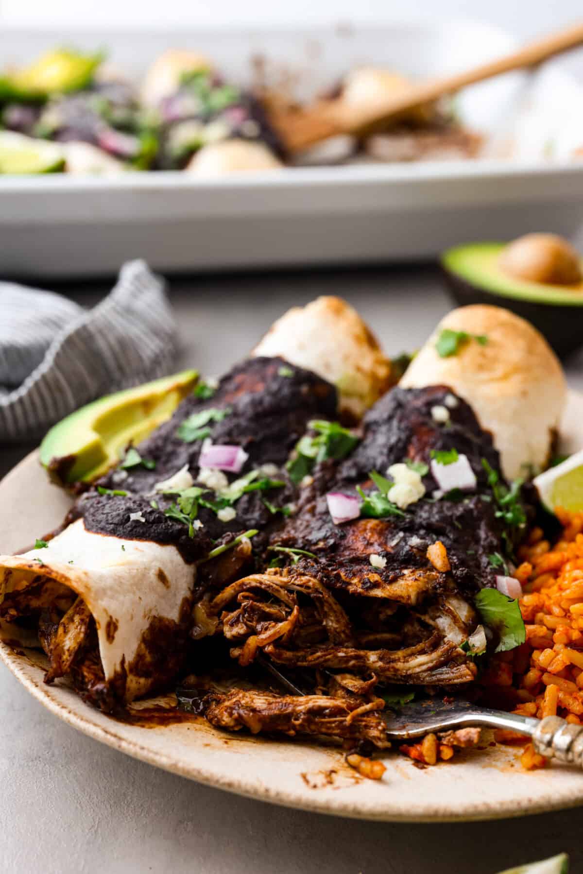Meet mole, the Mexican sauce that's a tasty blend of spices, from cumin's earthiness to chipotle's kick. What really sets it apart is the touch of cocoa powder added for a little sweet richness. It's the best blend of flavors, you're going to love it! 2 enchiladas covered with mole sauce.