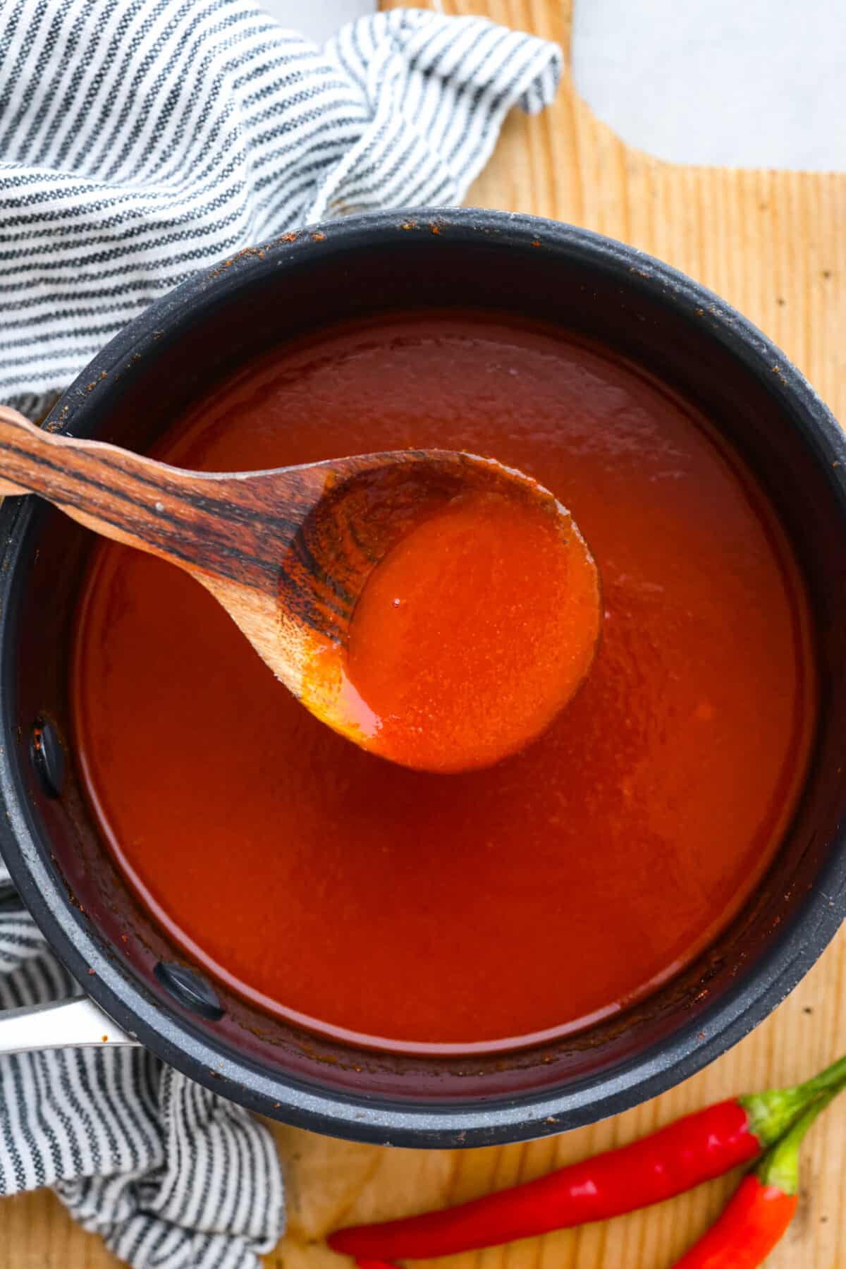 Sriracha sauce is a popular condiment that adds a burst of delicious spice to any dish. Try making it from scratch so it tastes just the way you like it! Sriracha sauce after being cooked in a large pot.