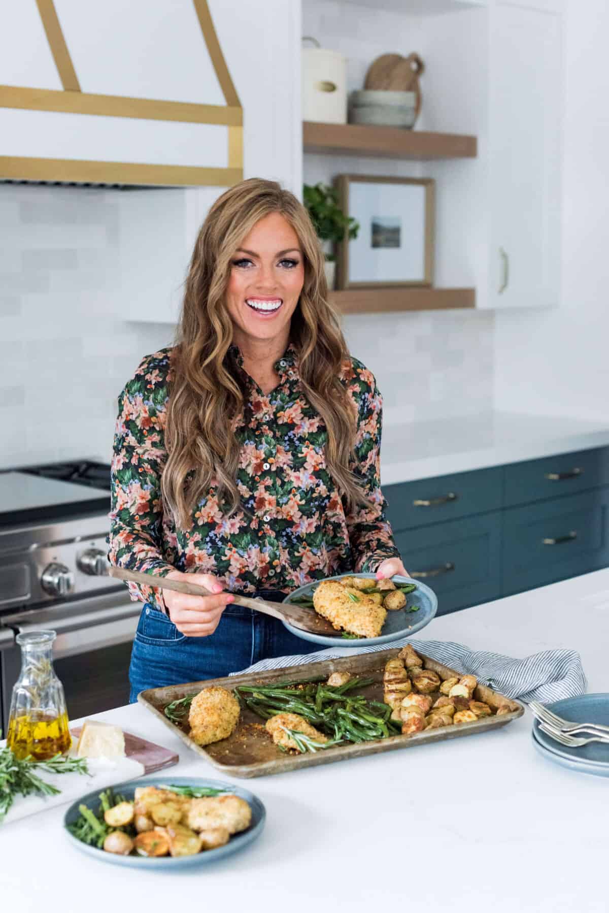 Welcome to my kitchen! am Alyssa Rivers, published author of 'The Tried and True Cookbook' and I am the foodie behind The Recipe Critic. Alyssa Rivers cooking chicken in her kitchen.