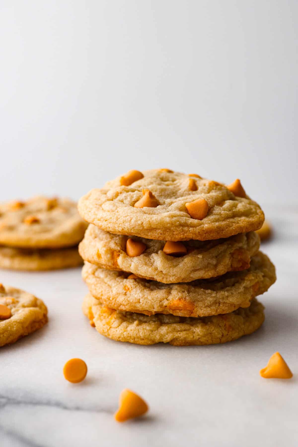 Satisfy your sweet cravings with these classic Butterscotch Cookies. Soft and chewy and packed with sweet butterscotch chips, these golden treats are easy to whip up, making them the ideal treat for any occasion. A stack of butterscotch cookies.