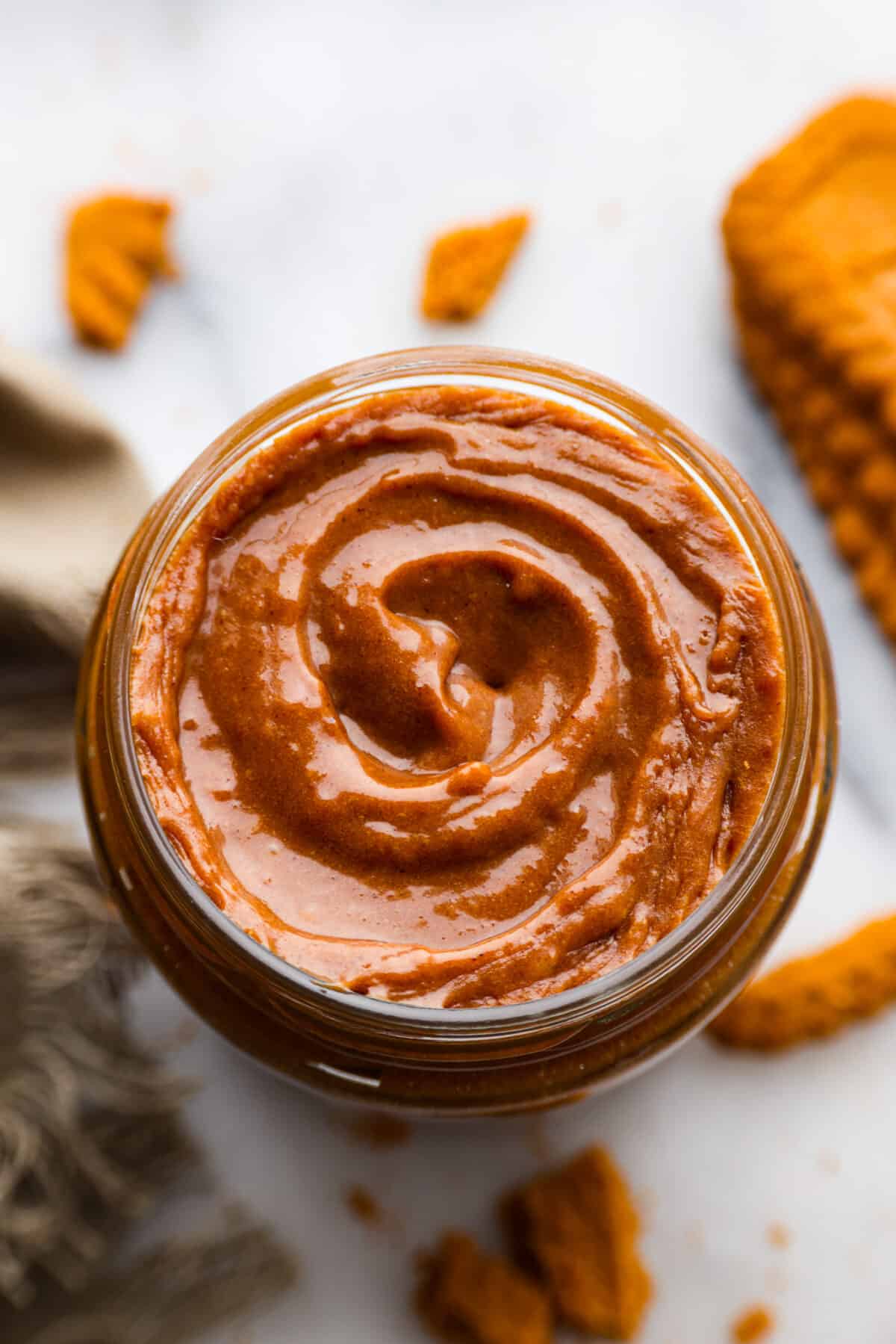 If you love Trader Joe's and you love their cookie butter, you are going to LOVE this recipe. This homemade version tastes exactly like it (except better), and then you can have it on hand all year long! The top view of cookie butter in a jar.