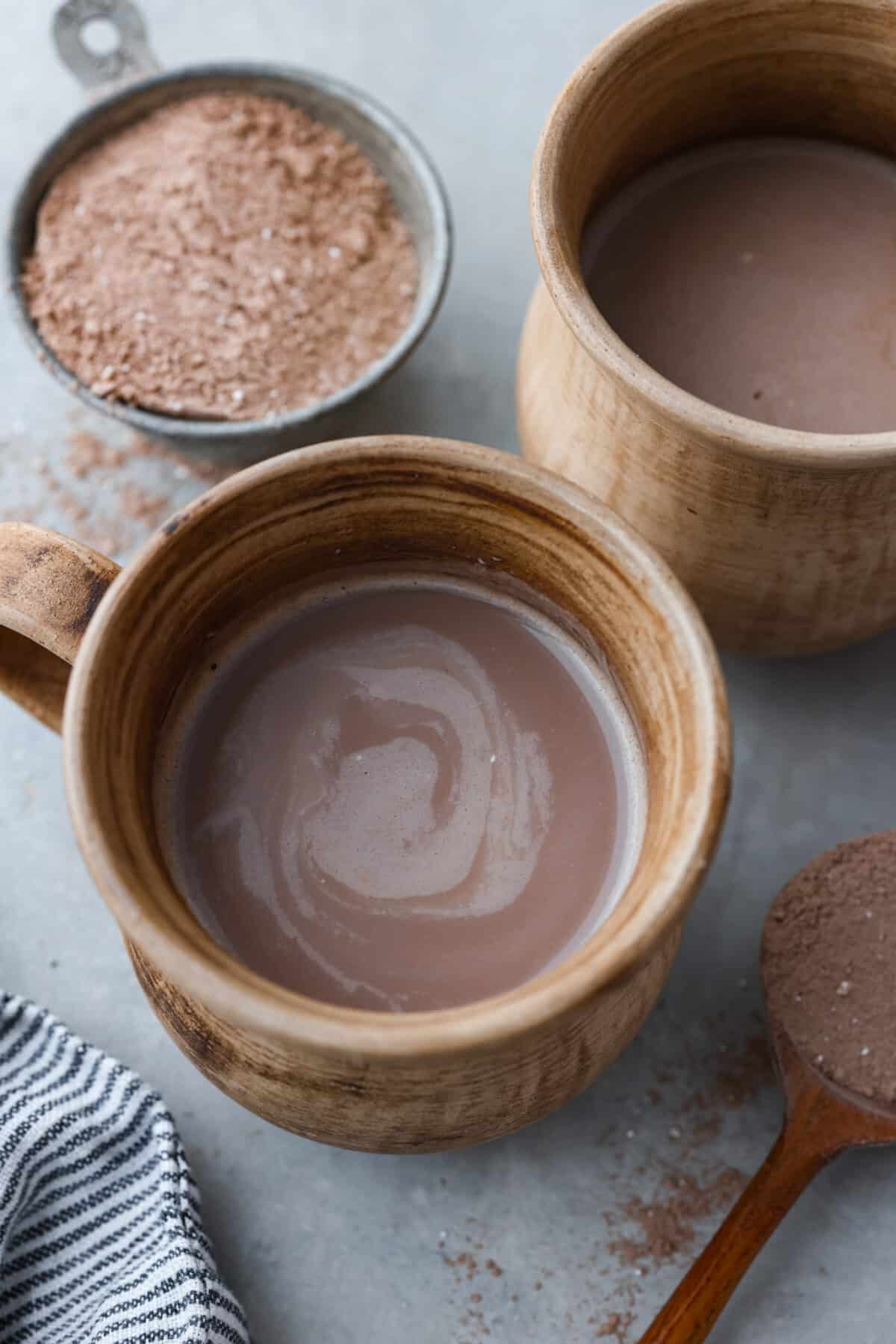 Delicious homemade hot chocolate mix that you can enjoy all winter long! It’s easy to customize and makes a perfectly rich and creamy cup of hot cocoa every time. Top-down view of a cup of hot chocolate.