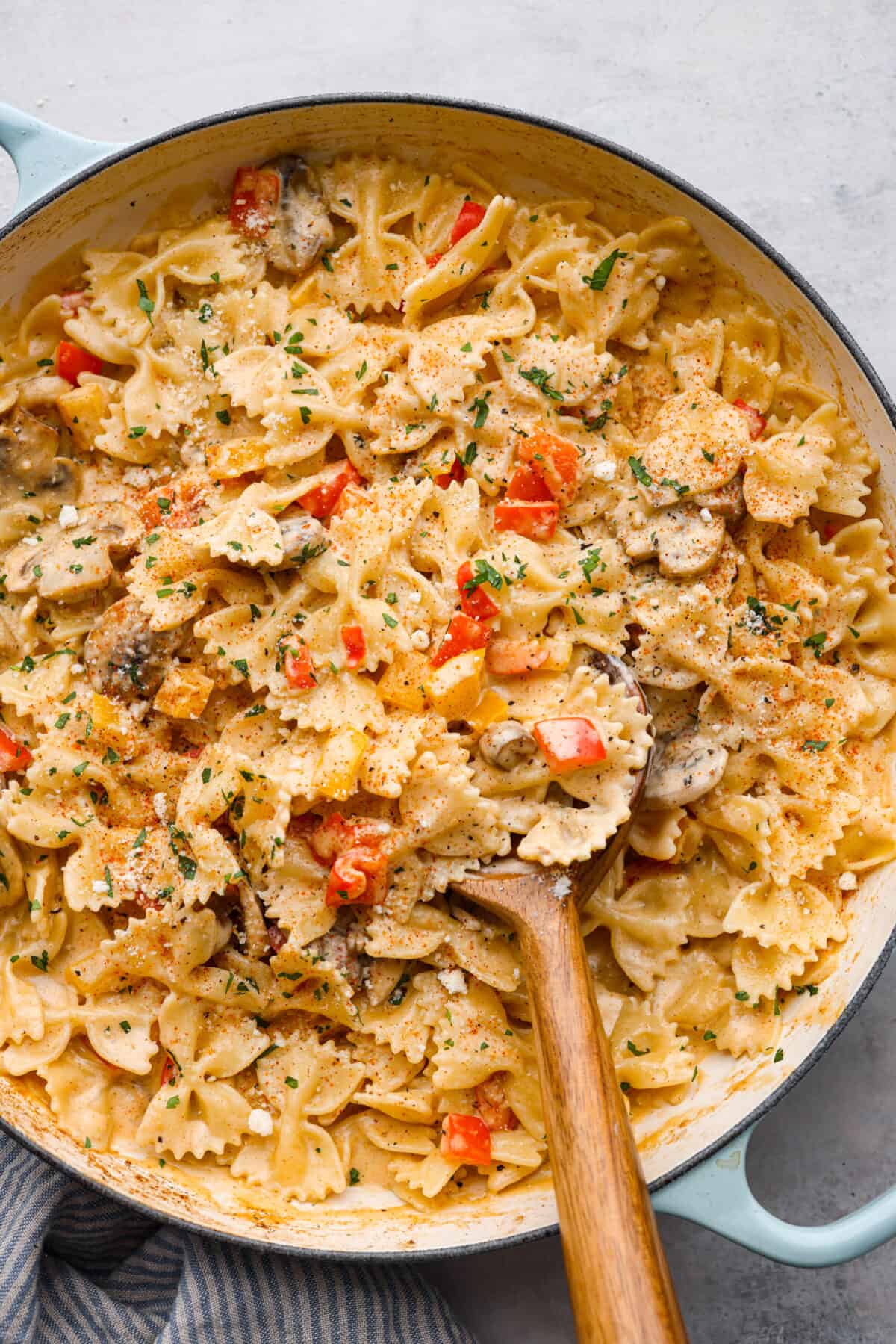 Breaded, crispy chicken cutlets and a creamy Cajun sauce come together in this AMAZING Louisiana chicken pasta recipe. Inspired by Cheesecake Factory, you're going to love making this at home! Top-down view of Louisiana chicken pasta.
