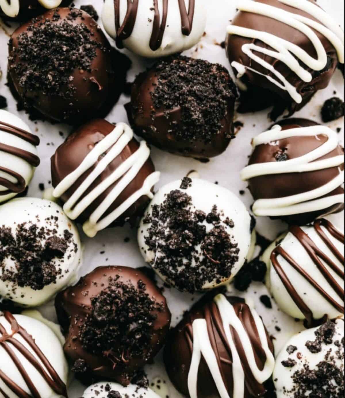 Easy no bake Oreo balls are decadent little truffles covered in a chocolate shell.ย Oreo crumbs and cream cheese create a sweet creamy texture on the inside. It only takes 3 simple ingredients to make this perfect party treat! Close up view of the Oreo balls on a platter.