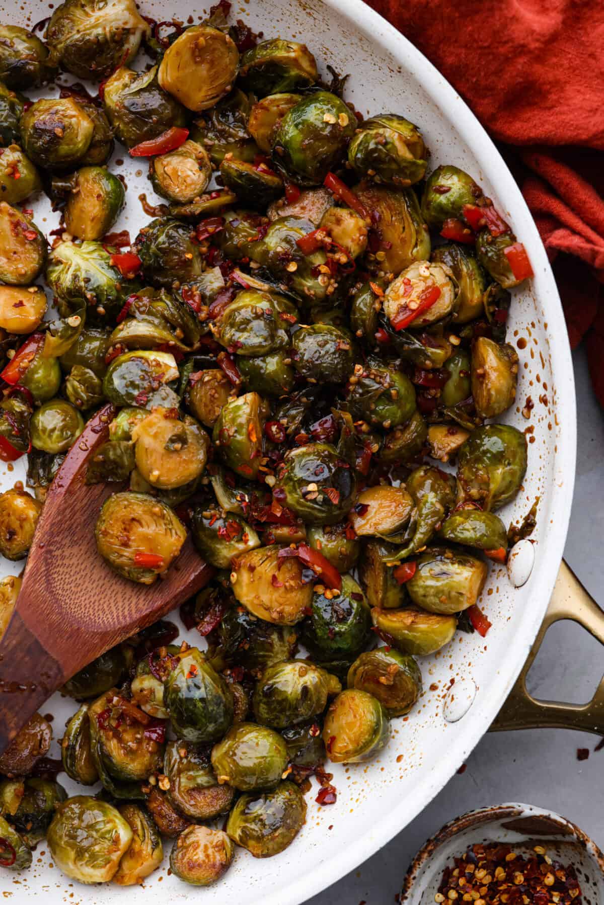 A classic Chinese takeout dish but made with one of my favorite veggies! Kung Pao brussels sprouts are stir-fried until they’re crisp and tender and have a kick of savory-spicy flavor in each bite. Simple, delicious, and guaranteed to please! Kung Pao Brussels Sprouts in a white skillet.