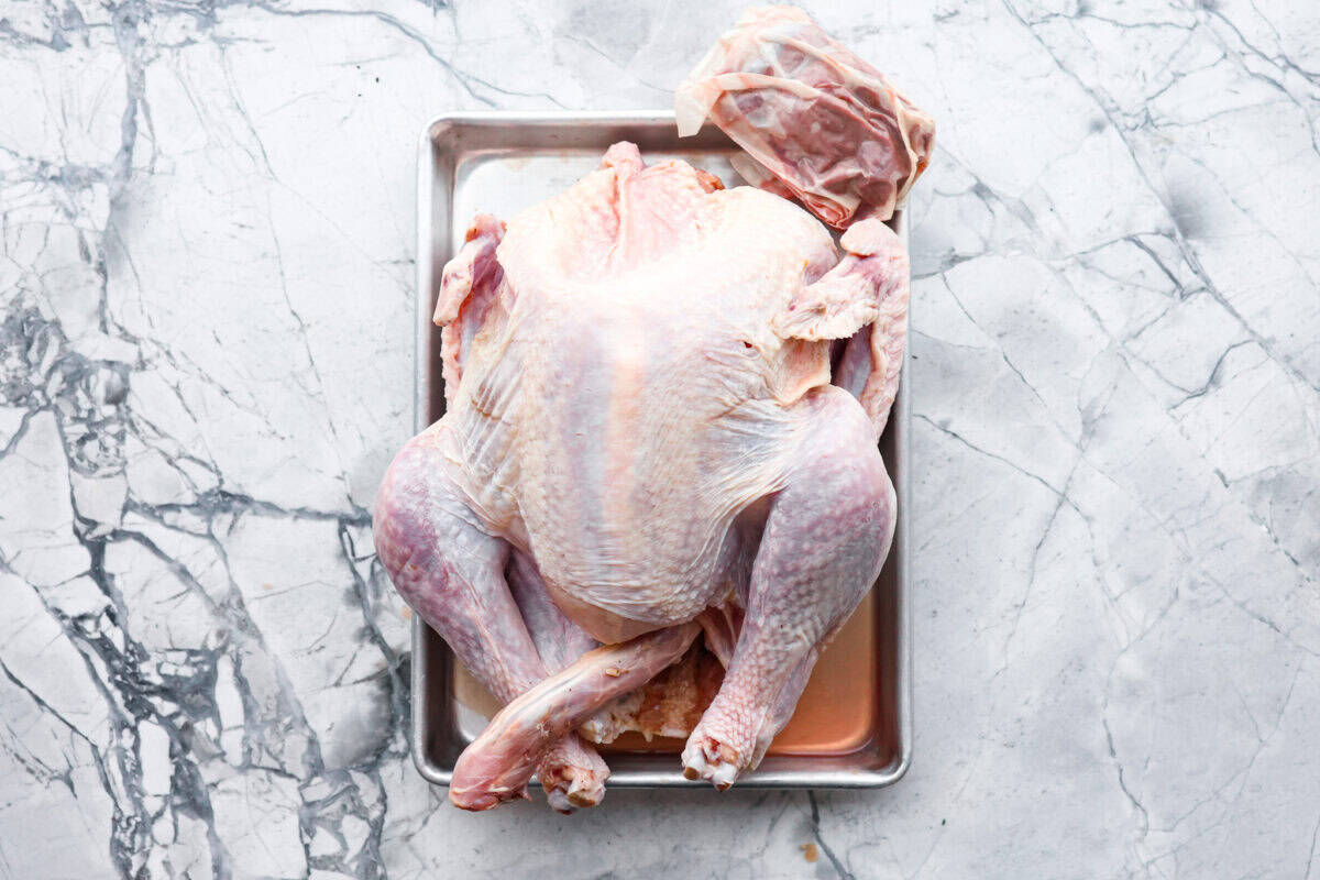 Look no further! This roasted turkey recipe is the absolute juiciest, fool-proof turkey recipe you will ever need. You'll have the confidence to make a perfect turkey every time. This deliciously seasoned turkey will be the star of your Thanksgiving meal! Second photo of the neck and giblets removed from the turkey.