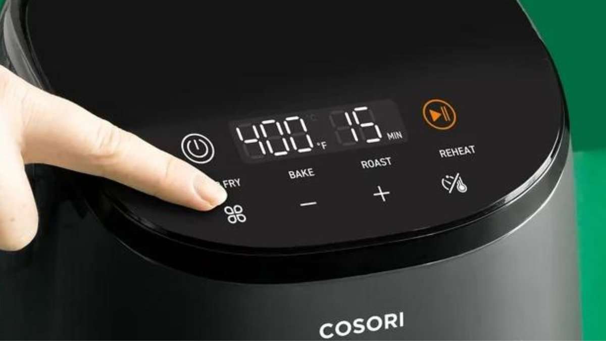 My air fryer is one of my favorite appliances in the kitchen because it can cook all my familyโs favorite recipes, including tender meats, roasted sides, crispy appetizers, and everything in between. A picture of someone pushing the button on the air fryer.