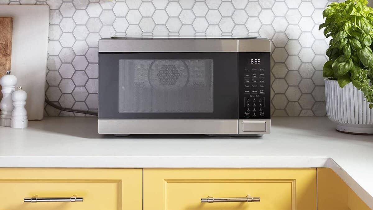 My air fryer is one of my favorite appliances in the kitchen because it can cook all my familyโs favorite recipes, including tender meats, roasted sides, crispy appetizers, and everything in between. A picture of a microwave on a countertop.