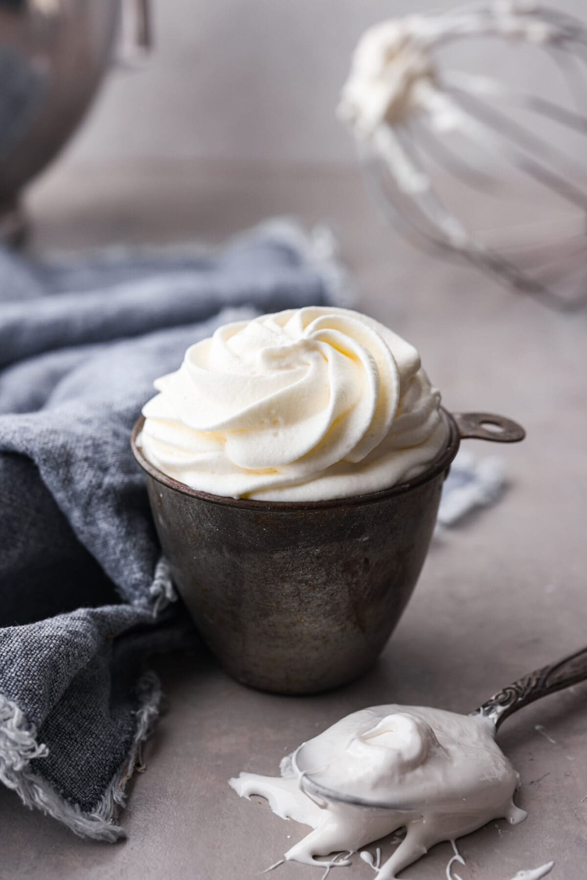 Two of my favorite things combined: marshmallow fluff and fresh whipped cream! It's perfect for adding to your favorite desserts, and is so good, you'll want to eat it straight from the bowl. Marshmallow whipped cream in a measuring cup.