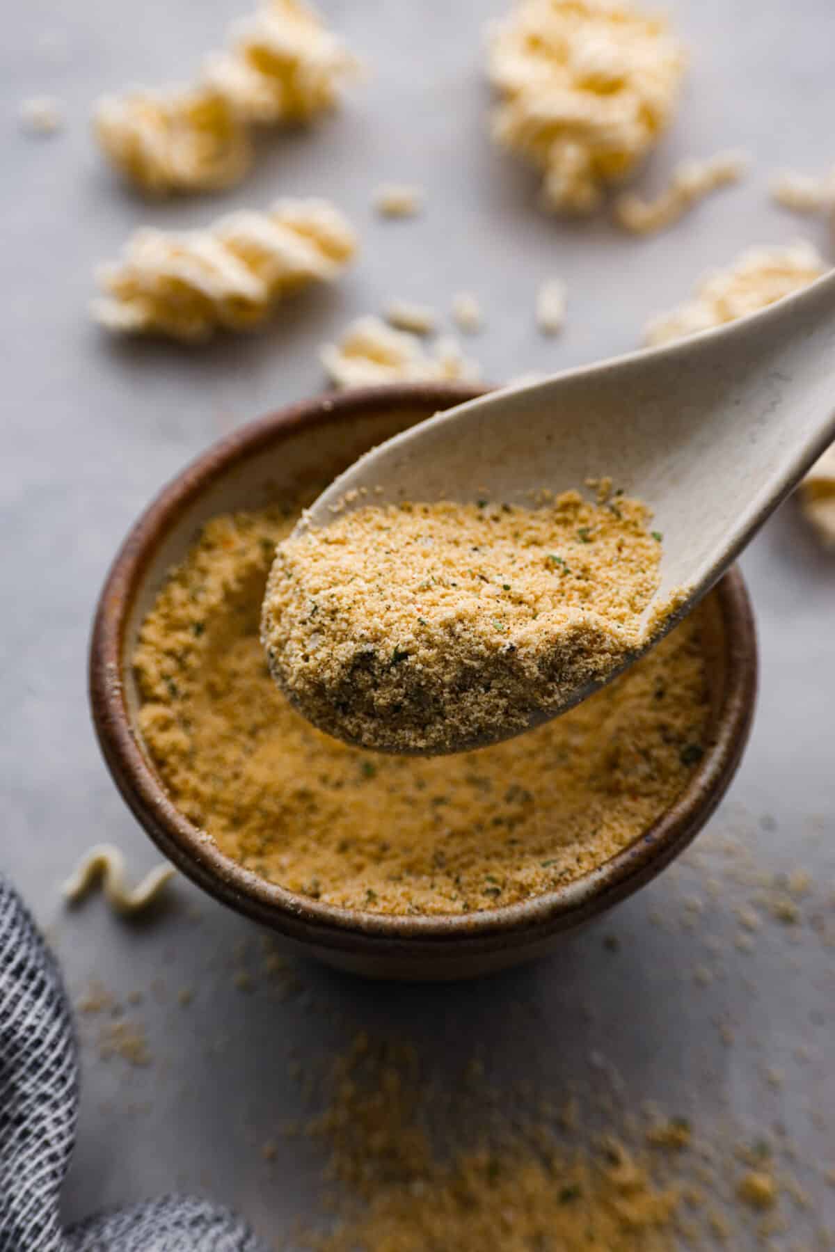 Ditch the flavor packet and elevate your bowl with this homemade ramen seasoning! Packed with savory spices and a punch of garlic, it's the secret ingredient to restaurant-worthy broth in just minutes. Closeup of a spoonful of ramen seasoning.