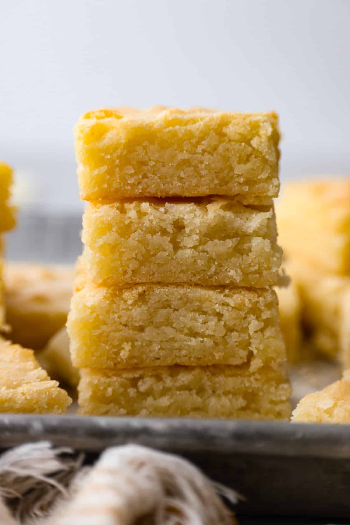 Moist, chewy, and loaded with creamy white chocolate flavor, these brownies will be your new favorite dessert. It only takes a few pantry staples to whip them up and they turn out perfectly every time. 4 white chocolate brownies stacked on top of each other.