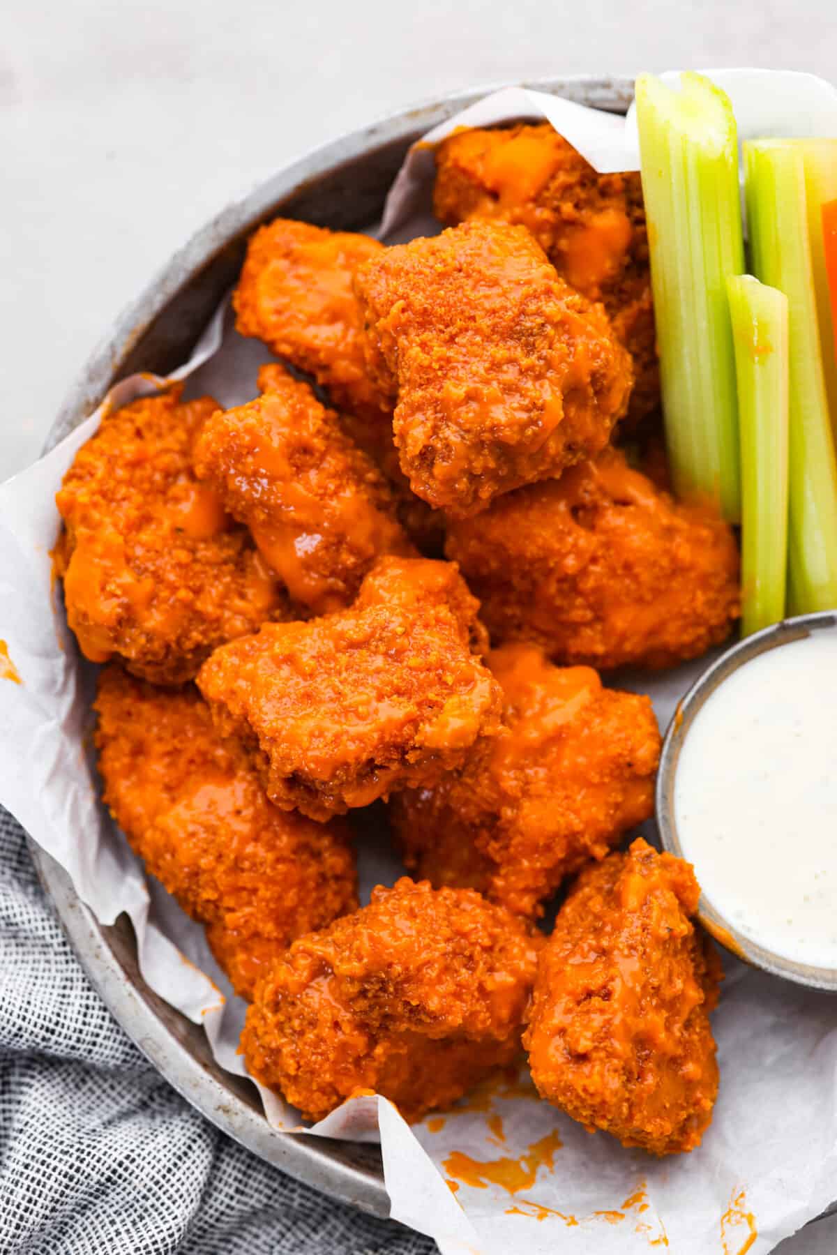 If youโre still working on your Super Bowl food lineup, add these amazing boneless wings to the list! They have a crispy buttermilk breading and are tossed in a mouthwatering buffalo sauce. Boneless wings served with celery sticks and ranch.