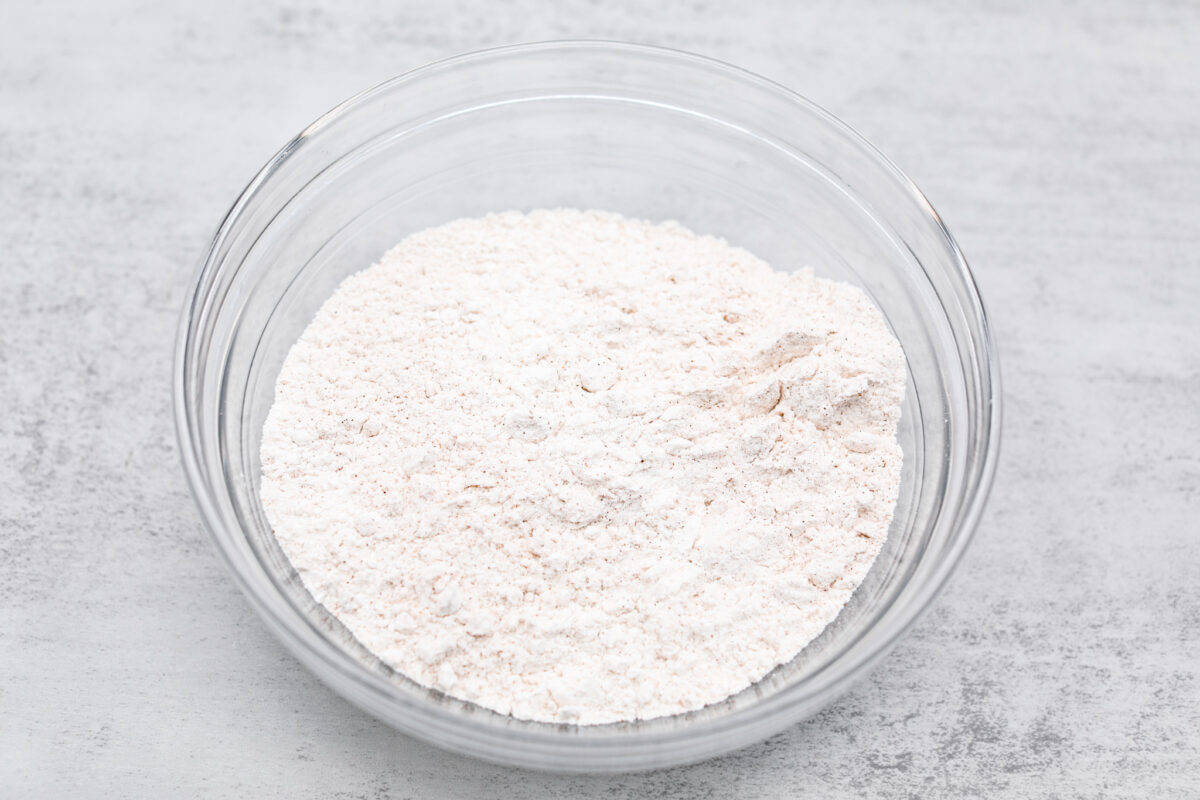 I see a batch of sweet and ultra-moist applesauce muffins in your future! Theyโre so delicious and made with all-natural sugars. The perfect breakfast, snack, dessert, you name it! The dry ingredients being combined.