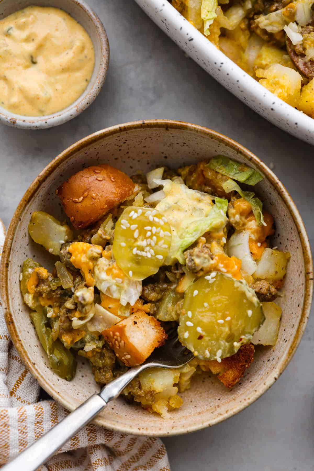 Meaty, cheesy, and chock full of tasty mix-ins like hash browns, pickles, and onions, Big Mac casserole is the perfect dinner to make this week! Itโs an easy, deconstructed version of the classic burger we all know and love. A serving of Big Mac casserole.