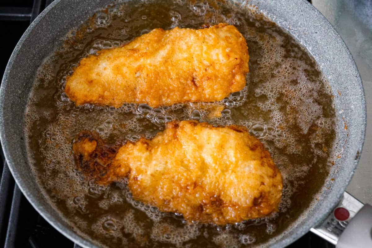 Bring all the best things about Southern cooking to your dinner table with this country fried chicken recipe! The result? Golden, crispy goodness smothered in savory homemade gravy. Frying the chicken cutlets in oil.