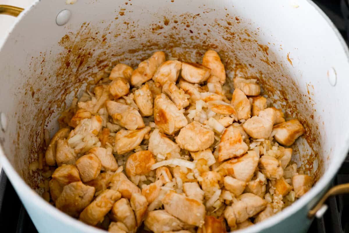 Cheesy, creamy, and loaded with ranch flavor and chunks of juicy chicken, 'Crack Chicken' pasta is a dinner that will have everyone raving! And as if you needed more reason to make it, it's ready in 30 minutes from start to finish! The chicken, onions, and garlic being sauteed.