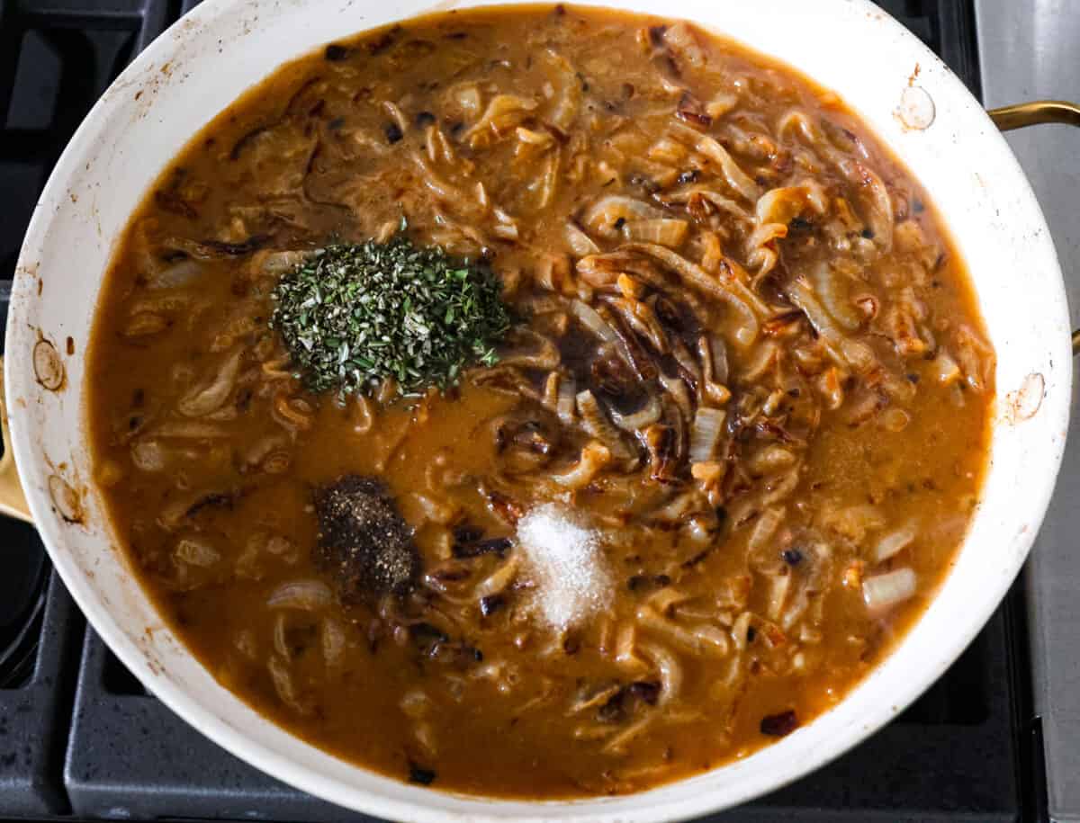 French Onion Pork Chops have all of the wonderful flavors of the classic soup in pork chop form! Caramelized onions and seared pork chops are joined with a savory sauce and two types of cheese for an amazing meal. Everything is cooked in one pan for a quick and easy weeknight dinner! Adding in seasonings