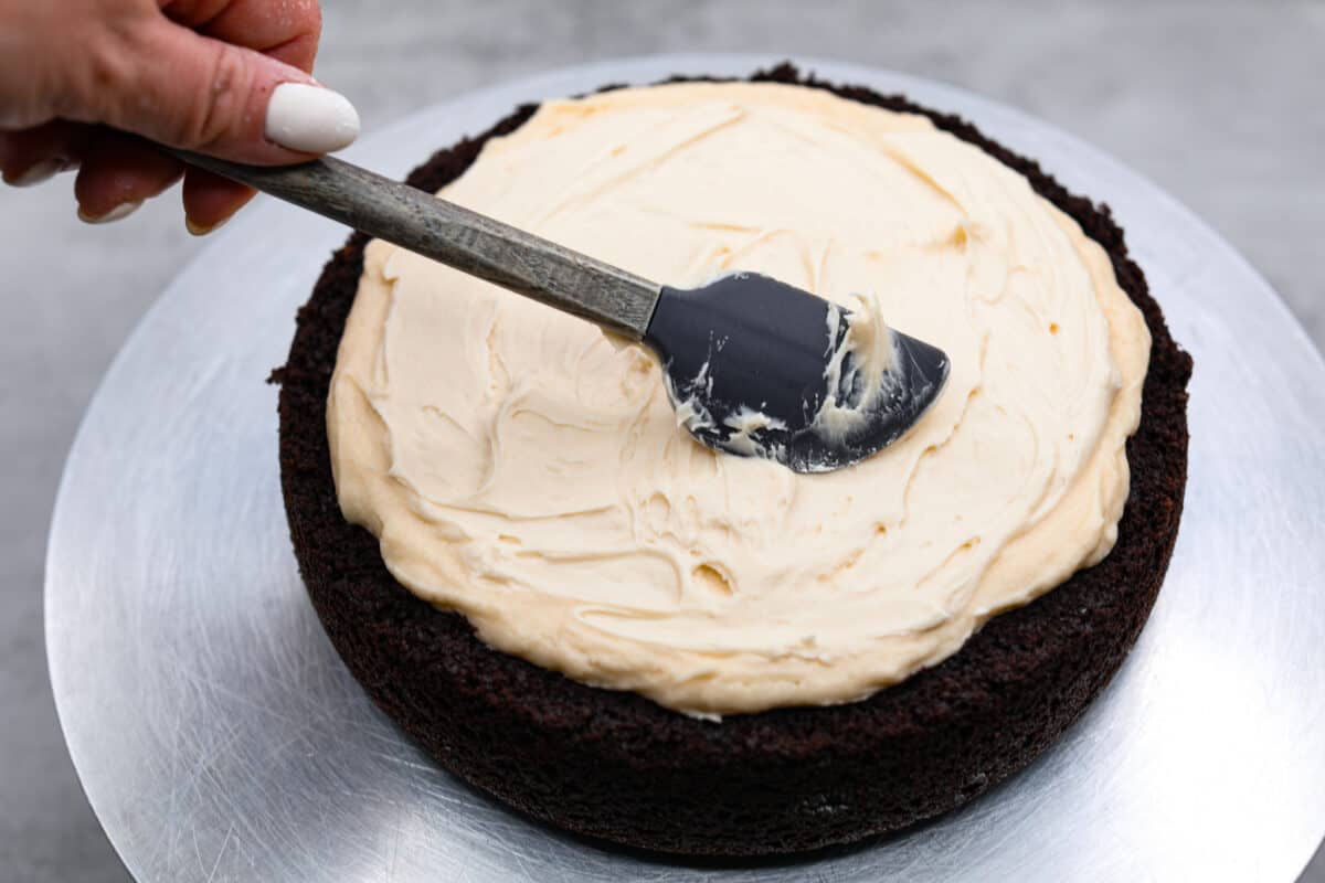 Celebrate St. Patrickโs Day (or any day) with this delicious Guinness Chocolate Cake! Itย has the most wonderful fudgy flavor and tender texture that is complemented by a Bailey's buttercream filling and a rich ganache frosting. Adding the cream layer to the cake