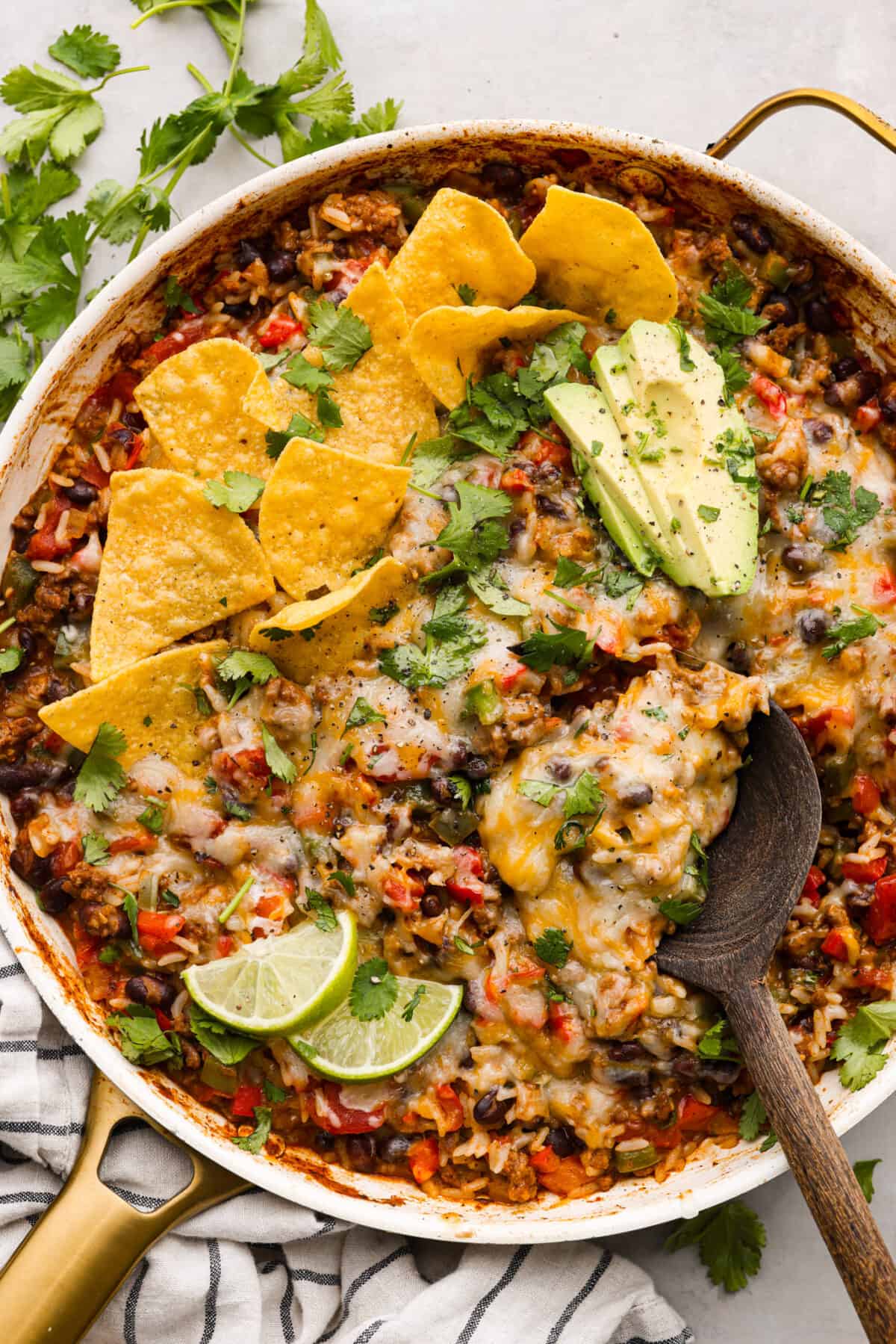 Okay, but can we talk about how gorgeous this taco skillet is?! Like, if dinner could be a showoff, this would be it. Itโs giving melty, cheesy, golden perfection, and the best part? It all comes together in one pan. Rice, cheese, vegetables, and ground beef cooked together in a skillet.