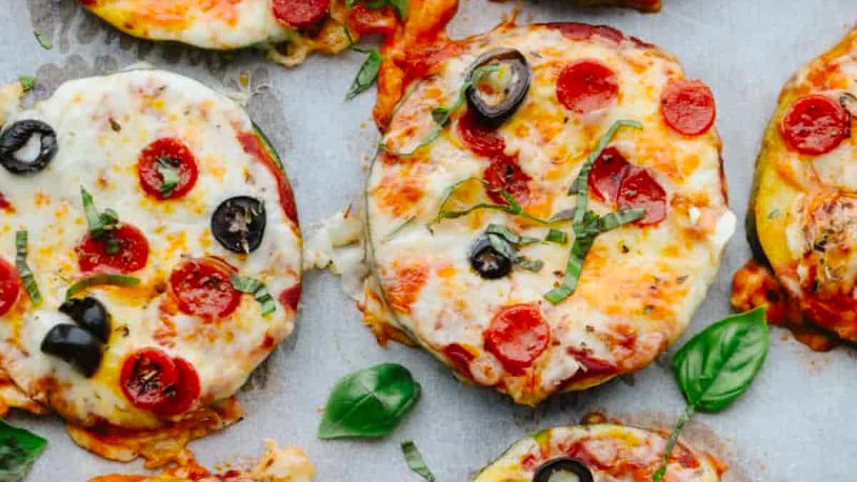 The best portable pizza ovens get hotter than the oven in your kitchen, so they deliver pizzeria-quality pizzas that are piping hot with crispy crusts and bubbly cheese Top view of mini pizzas.