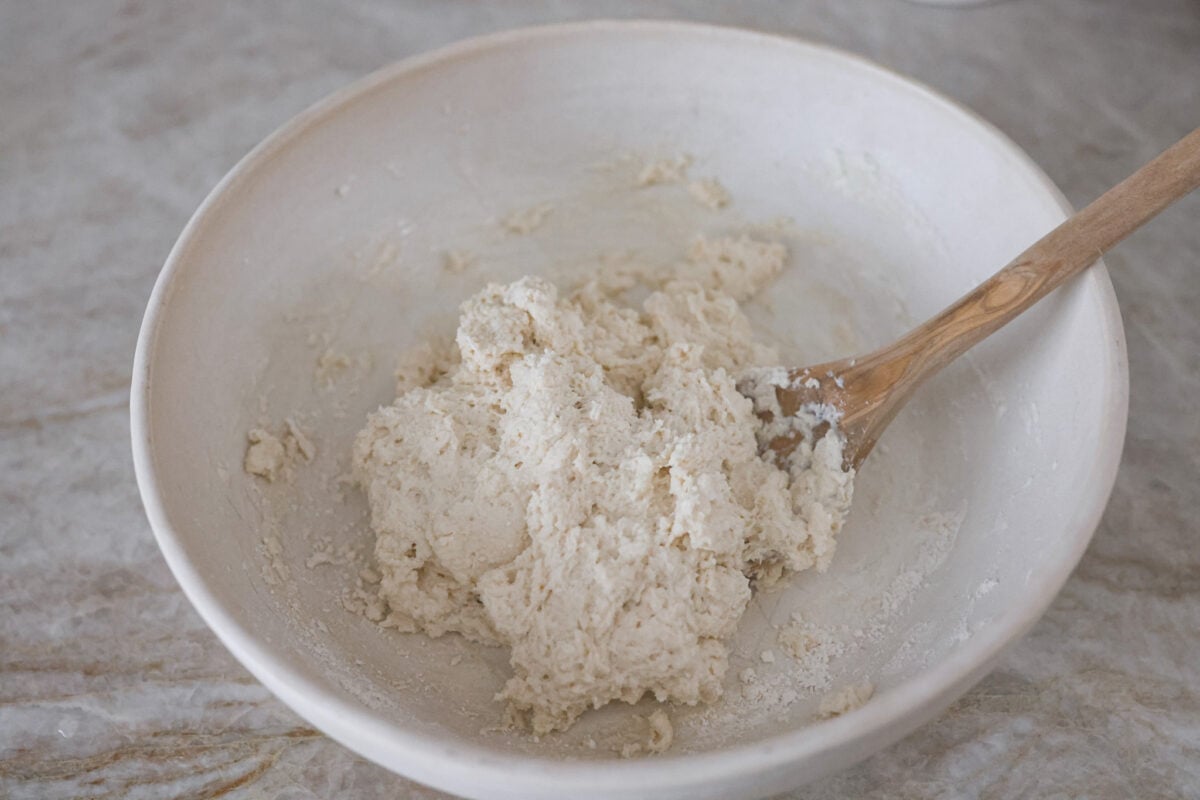 Tender and fluffyย 7-up biscuitsย rise to perfection and instantly become everyone's favorite biscuit! It only takes 4-ingredients to create this melt-in-your-mouth biscuit recipe! Third photo of the dough formed in a bowl.