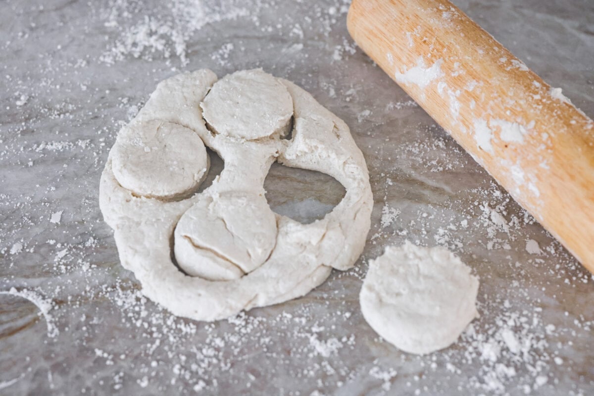 Tender and fluffyย 7-up biscuitsย rise to perfection and instantly become everyone's favorite biscuit! It only takes 4-ingredients to create this melt-in-your-mouth biscuit recipe! Fourth photo of the 7 up biscuits rolled out and cut into biscuit shapes.