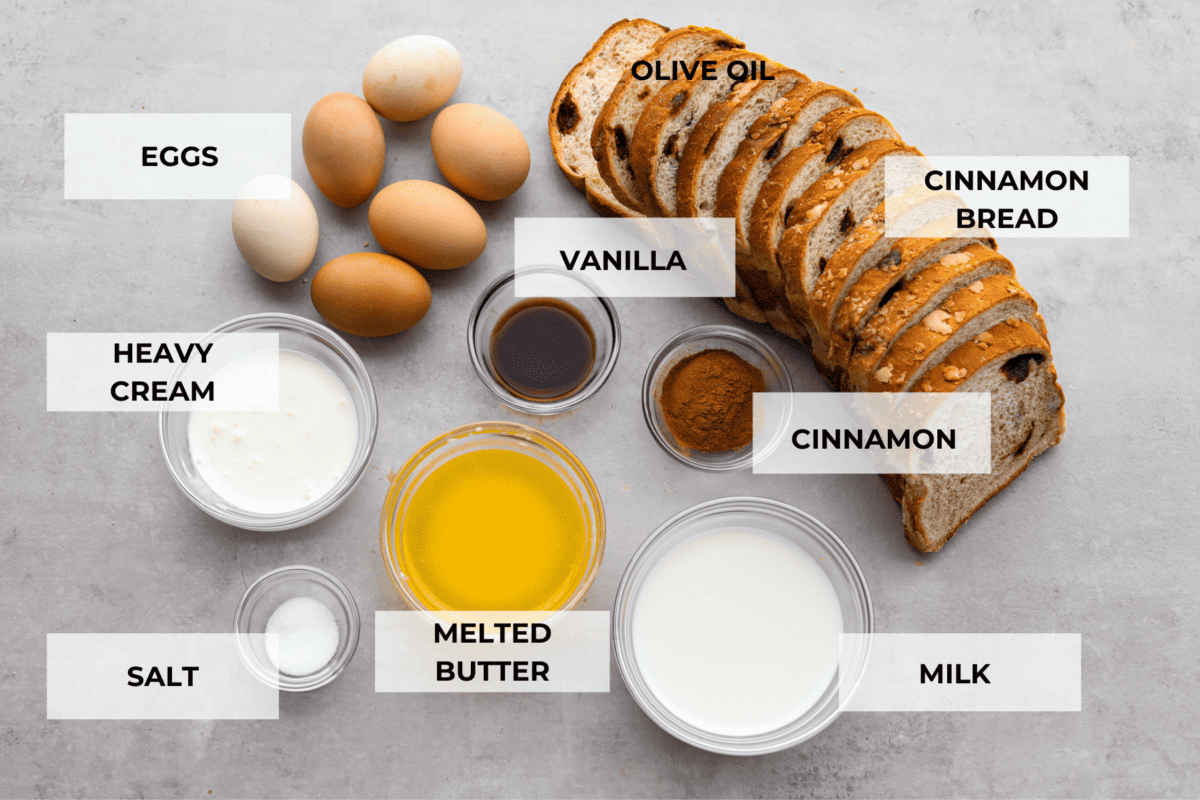 Cinnamon French toast bake is a warm and satisfying breakfast that's loaded with soft and sweet spiced bread all drizzled in maple syrup. Your family will go crazy over this insanely delicious (and easy-to-make) breakfast! All of the French toast ingredients laid out. Listed are: eggs, heavy cream, salt, melted butter, milk, vanilla, cinnamon, and cinnamon bread.