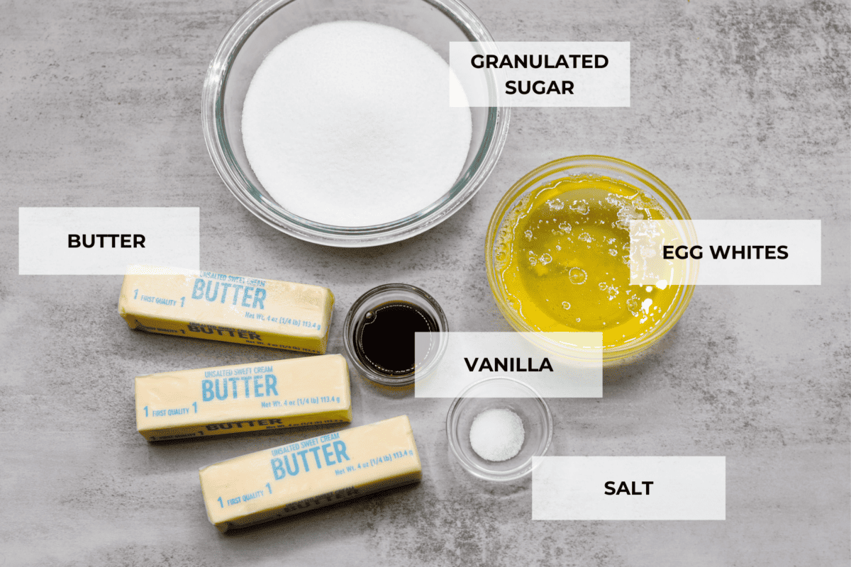 The most delicious Swiss Meringue Buttercream is easy to make with just 5 simple ingredients! It whips up deliciously light and silky with the right amount of sweetness. The perfect finishing touch for all of your favorite treats! All of the ingredients for the frosting: butter, sugar, salt, vanilla, and egg whites.