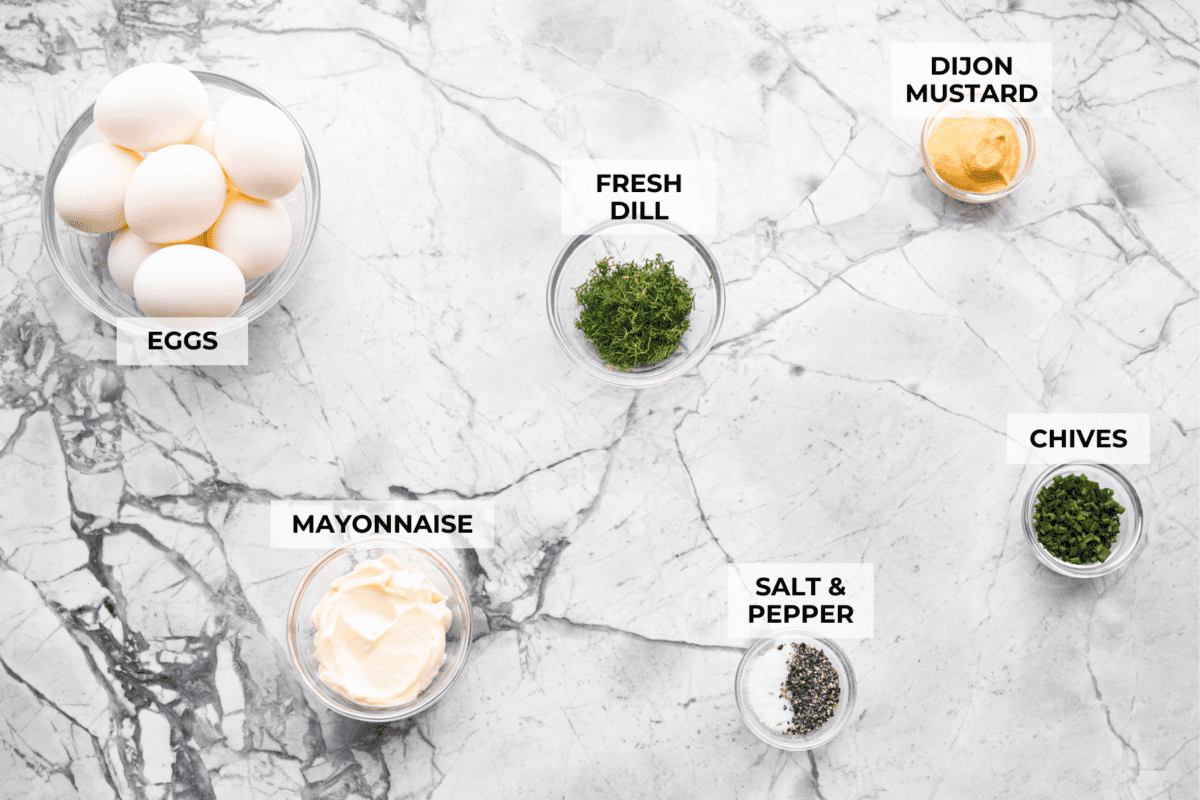 This egg salad has been a reader favorite for years because itโs creamy, simple, and lets the eggs shine. Itโs made with just a few ingredients, but the flavor is absolutely amazing and you can make it in just 25 minutes! A top down shot of all of the ingredients in individual bowls.