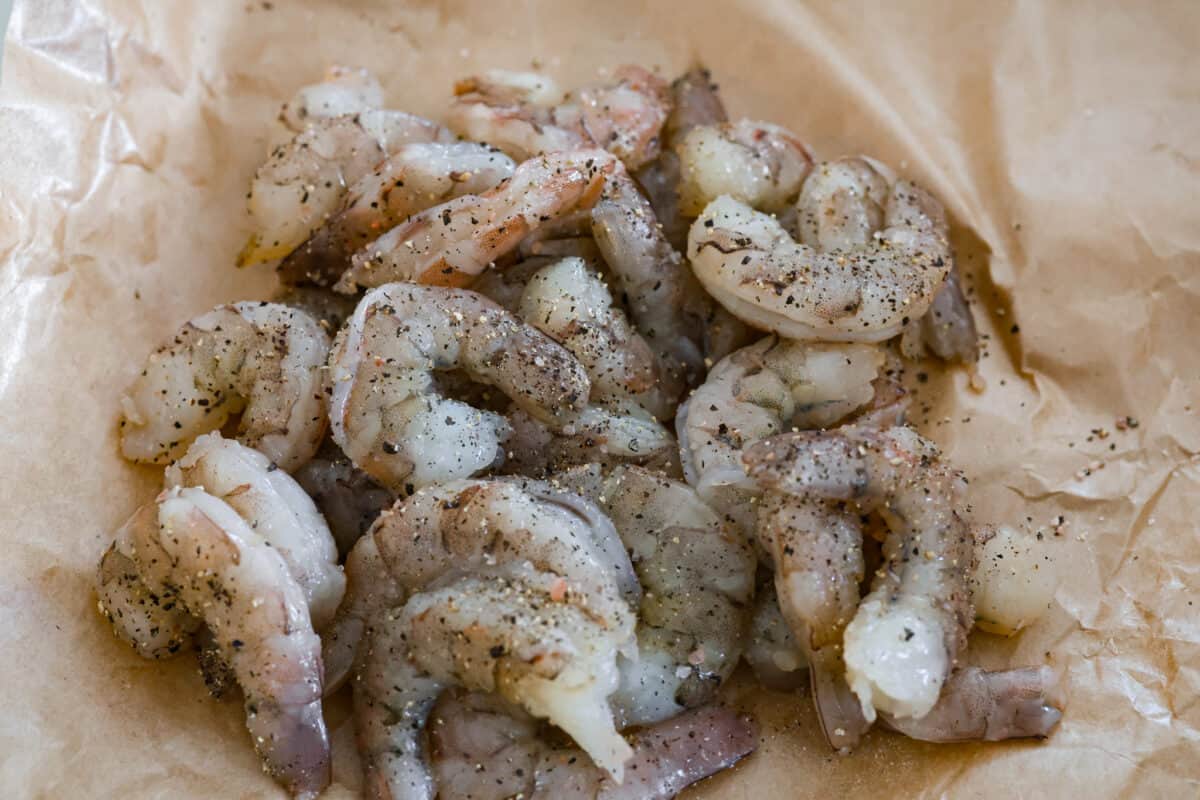 These Bang Bang Shrimp Tacos are made with deliciously crunchy shrimp cooked to perfection and coated in a special sauce that's just bursting with flavor! It's a meal that's sure to impress. shrimp seasoned with salt and pepper.