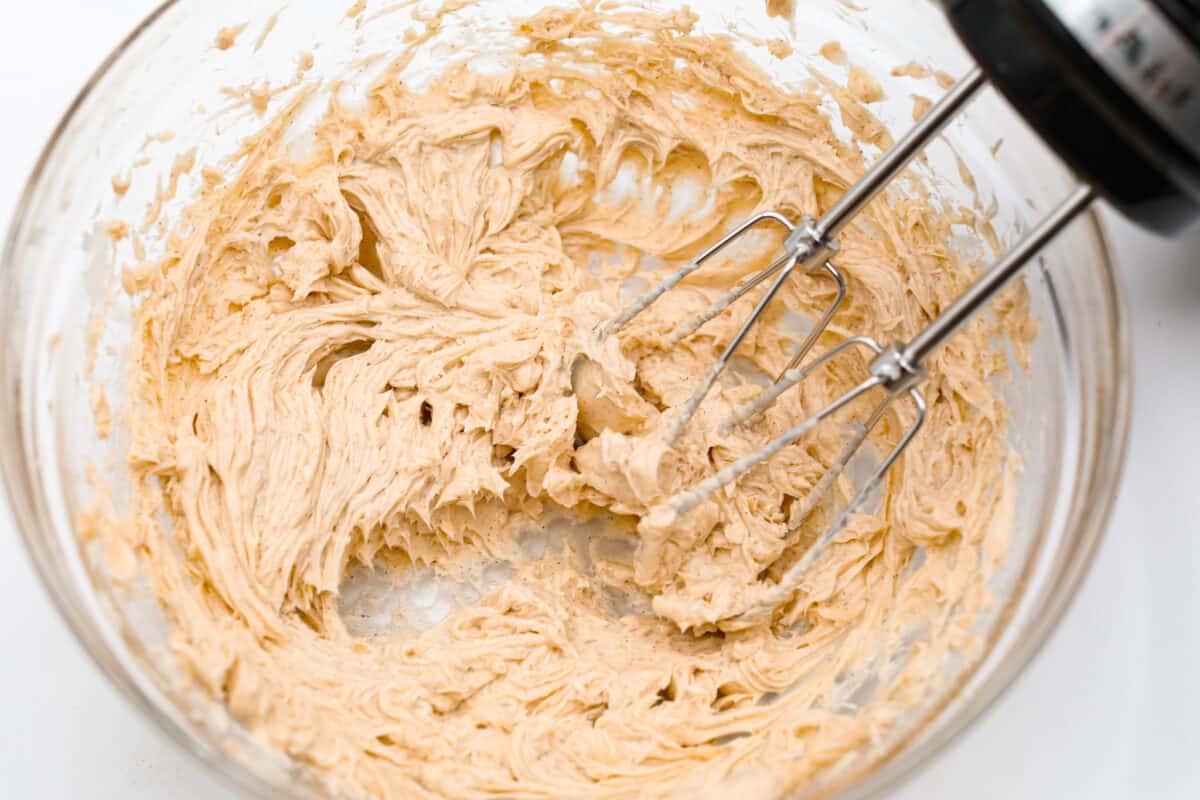 This honey butter recipe is so easy to make, and perfect on everything from rolls and toast to muffins. One taste and you’ll be hooked! Whipping the butter with a hand mixer.
