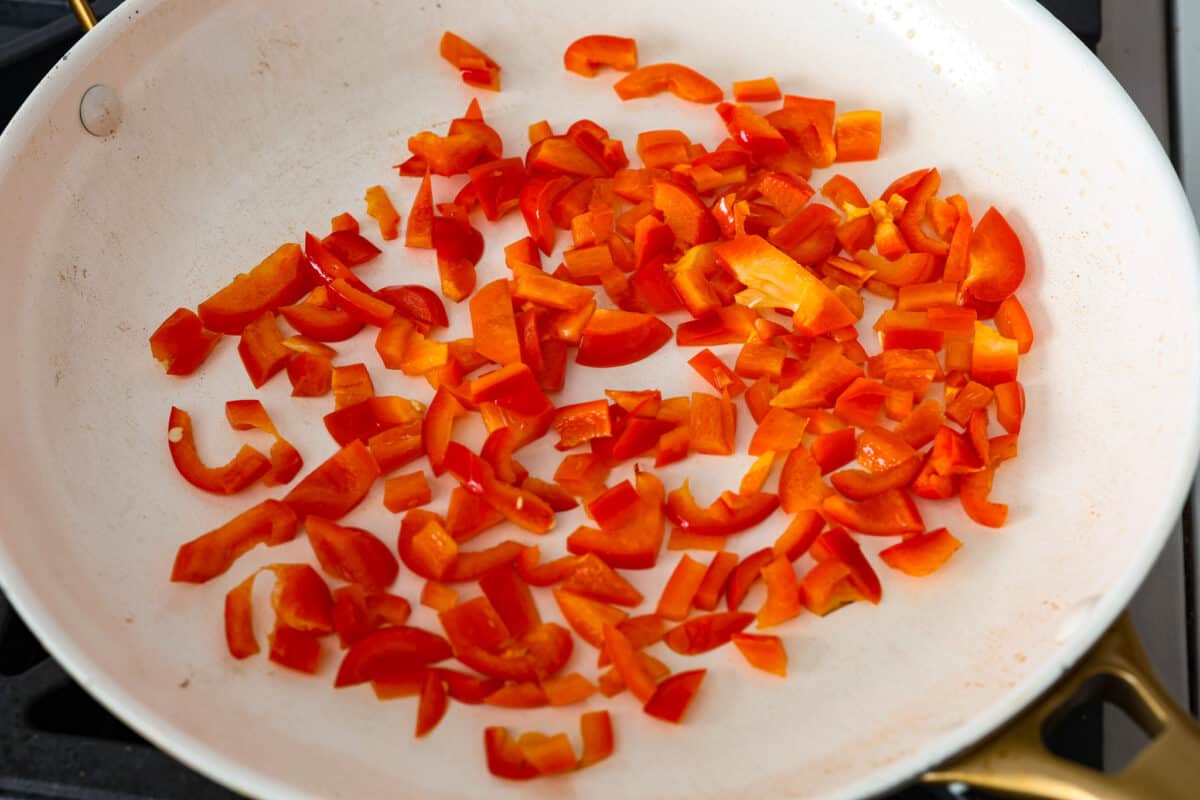 Sheet pan eggs are not only fluffy and full of flavor, but the best way to meal prep eggs or feed a crowd! Add your favorite mix-ins and serve as-is or use them to make breakfast sandwiches or as a topping for avocado toast! Sautรฉing the peppers