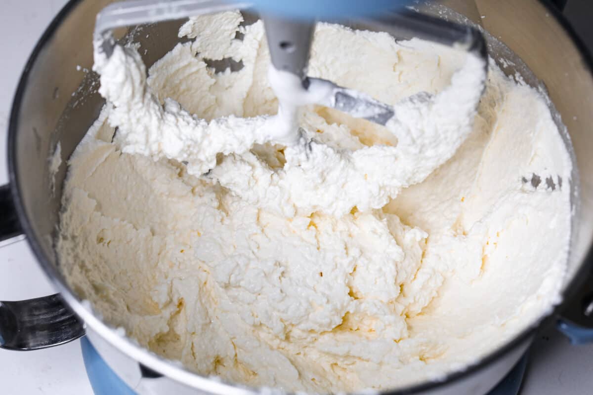 The most delicious Swiss Meringue Buttercream is easy to make with just 5 simple ingredients! It whips up deliciously light and silky with the right amount of sweetness. The perfect finishing touch for all of your favorite treats! Mixing until the right consistency is achieved