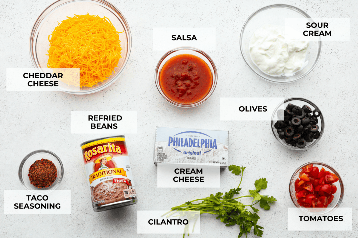 Bring out the chips and start dipping because this is the most addicting bean dip you will ever have! It's creamy, cheesy, and loaded with tasty Mexican-inspired flavors. Garnish with toppings, and take this to your next gathering! Ingredients labeled to make bean dip.