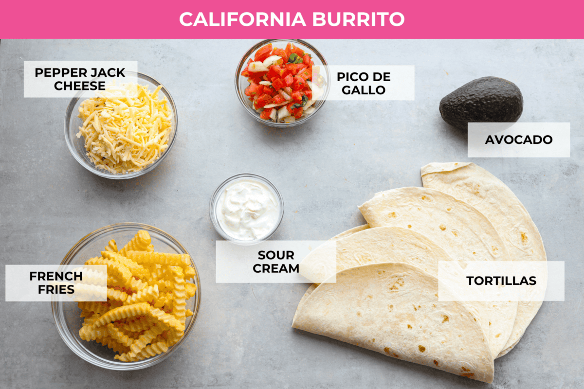 This delicious California Burrito is filled with well-seasoned grilled steak, pepper jack cheese, French fries, pico de Gallo, sour cream and avocado, all wrapped up in a warm flour tortilla. A flavorful lunch or dinner option that will be an absolute hit! Ingredients for the filling of a California burrito in a top down shot with labels for each ingredient.