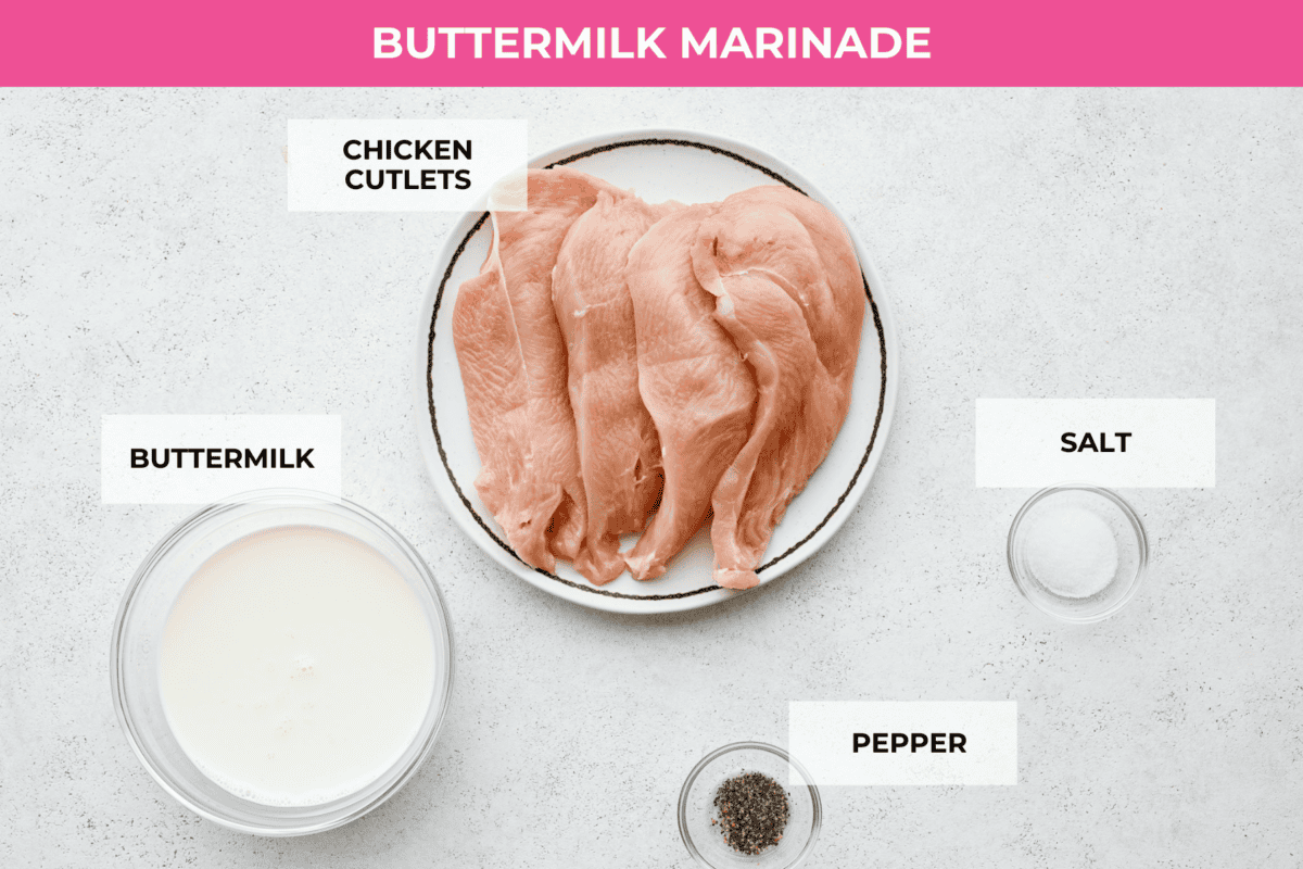 Bring all the best things about Southern cooking to your dinner table with this country fried chicken recipe! The result? Golden, crispy goodness smothered in savory homemade gravy. The raw chicken breasts and marinade ingredients: buttermilk, salt, and pepper.