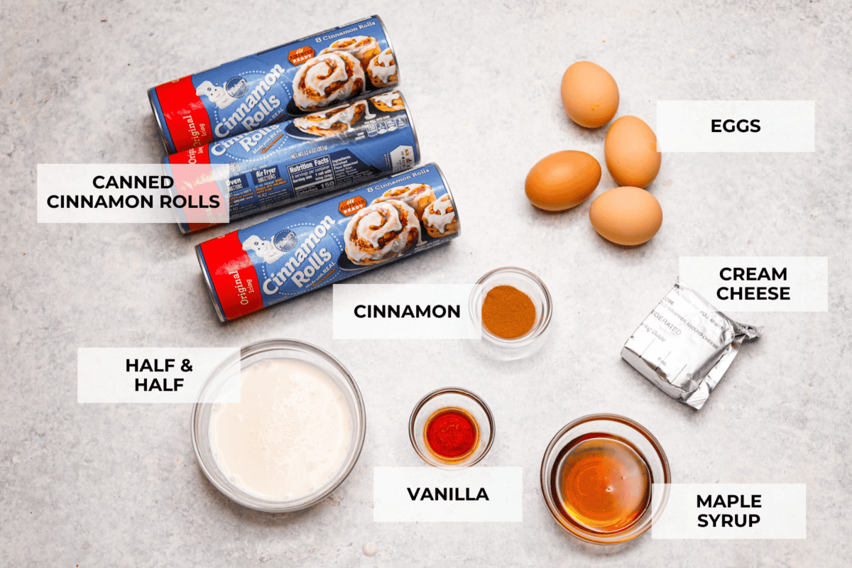 Get ready for a tasty treat with this easy cinnamon roll casserole! Using canned cinnamon rolls, this casserole is so delicious with creamy icing drizzled over warm, golden rolls. It's perfect for any breakfast or brunch! The top few of all of the ingredients laid out and labeled.
