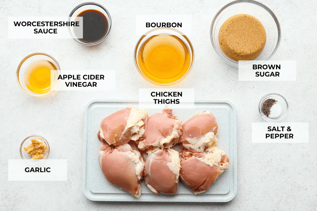 One bite of this grilled bourbon chicken and your tastebuds will be dancing with delight! It's marinated in a flavorful homemade bourbon sauce that tastes amazing. You will be making it on the regular once you see what a huge hit it is! Top view of all of the ingredients measured out in individual bowls and labeled.