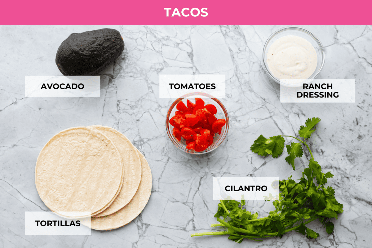 Switch up taco night with these 4-ingredient slow cooker ranch tacos! The chicken shreds perfectly and is packed with flavor. Dinner has never been easier! Ingredients labeled to make the tacos.