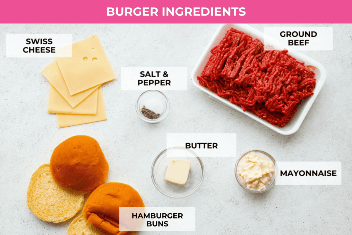 Create the most flavorful, juicy Mushroom Swiss Burger! Perfectly seasoned ground beef is topped with sautรฉed buttery mushrooms and melty Swiss cheese then loaded on fluffy buns for a gourmet burger that's easy to make at home! A topview shot of all of the ingredients laid out of a counter for the burger.