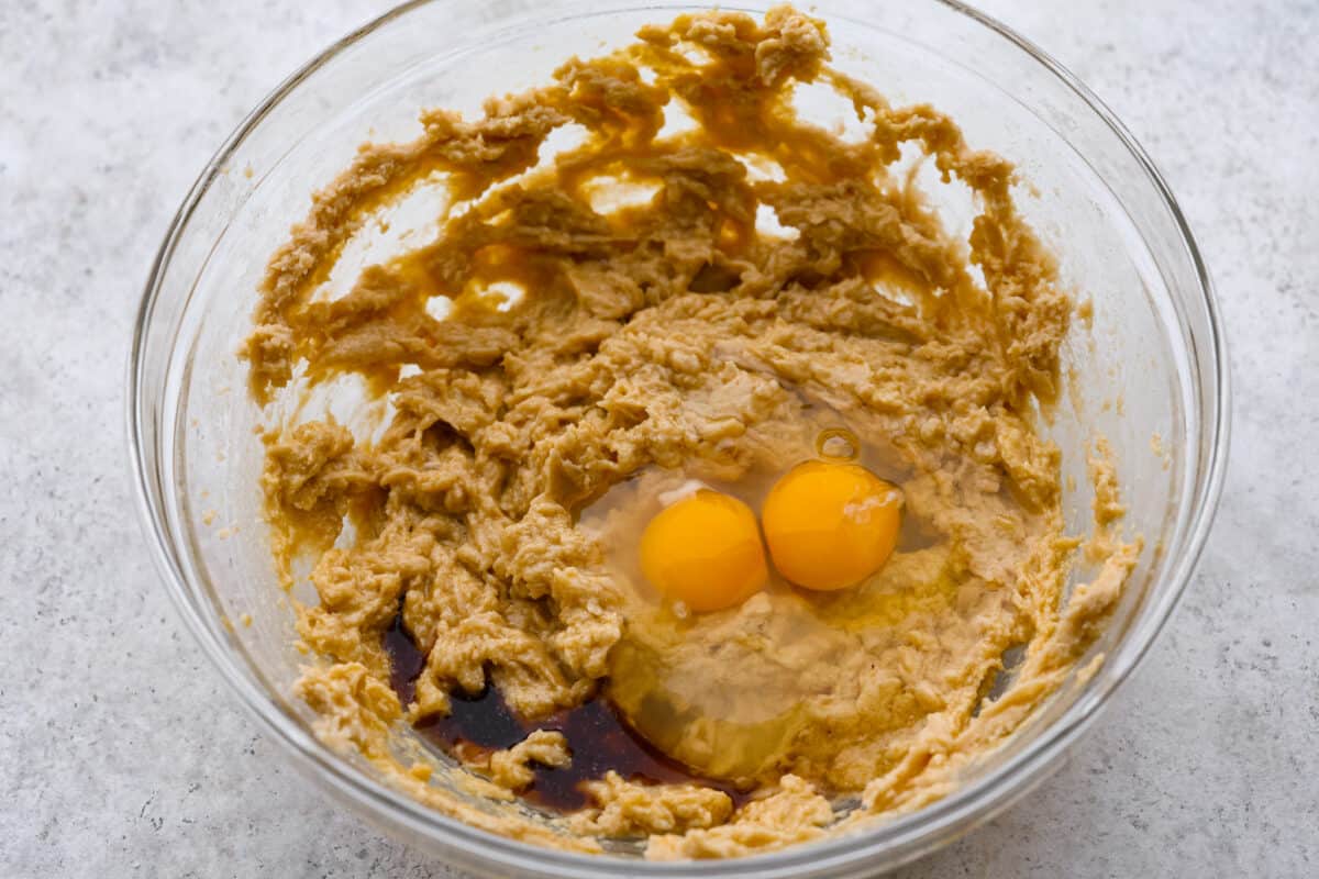 Introducing the softest and chewiest chocolate chip pudding cookies to ever come out of your oven! Adding Instant pudding mix creates the perfect cookie that dreams are made of. Second phot of the eggs and vanilla added.